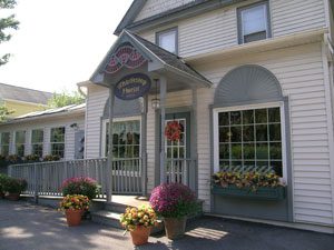 A building with flowers in front of it.